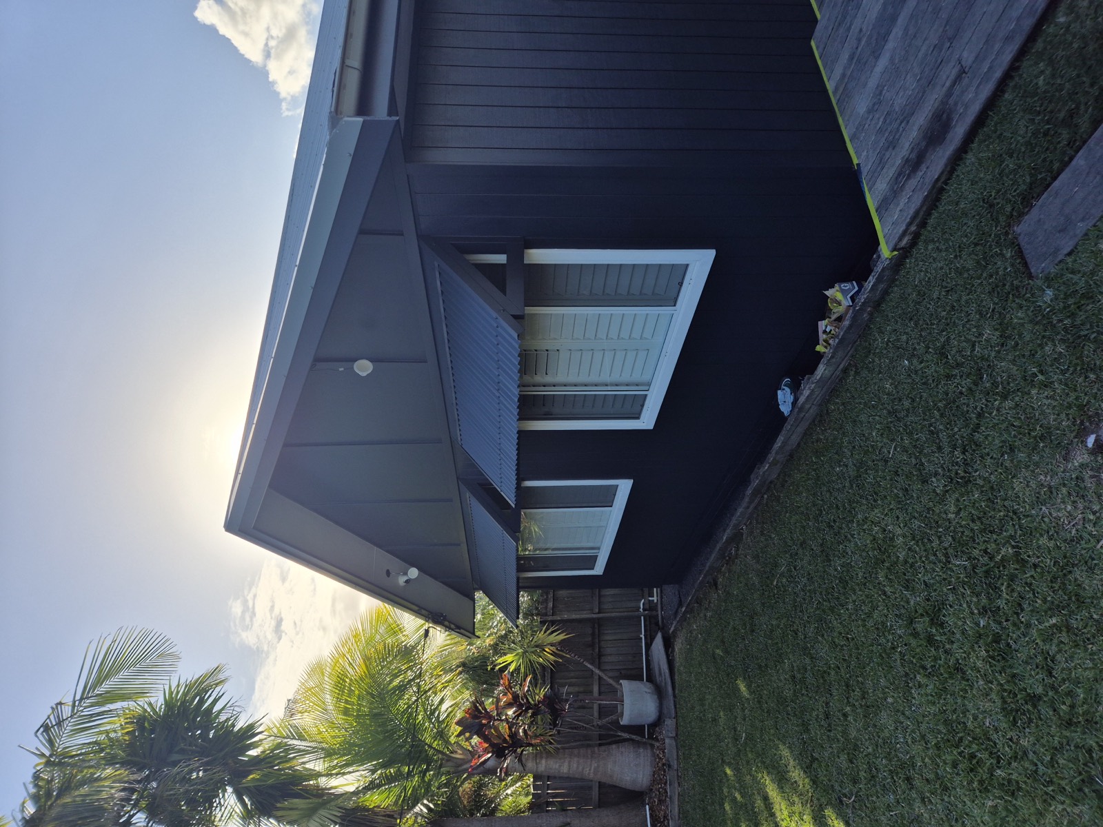 Bold dark exterior repaint on a Central Coast home
